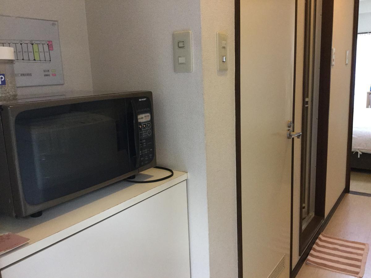 Business Inn Grandeur Фучу Екстериор снимка
